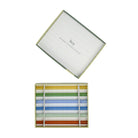 Top-down view of the open box, the straws lying in a divided tray with the lid set above.