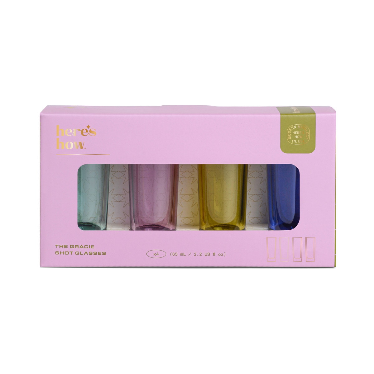 Pink Here's How gift box with a window showing four coloured shot glasses standing in a row.