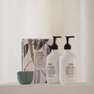 Salus Hand Rescue Duo pump bottles and gumnut print gift box beside a small green bowl