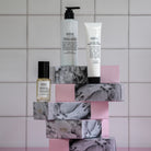 Salus Hydration Trio hand wash, hand cream and facial mist stacked on petal print boxes
