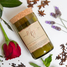 Rose, Pepper & Blackmint candle in an olive reclaimed wine bottle with red rose, lavender, star anise and cloves