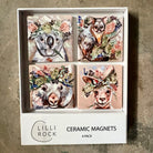 Boxed set of four ceramic magnets - a koala, possum, wombat and kangaroo each wearing a native flower crown