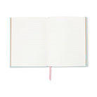 The journal open to its lined ivory pages