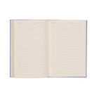 The journal open to its lined ivory pages