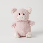 Pink plush piglet rattle sitting up, with a cream snout, cream-tipped ears and cream feet