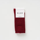 Cherry red KLUE glitter lurex socks folded in their branded paper band