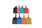 Leather luggage tags in two rows: black, pink, aqua and red above, brown, cobalt, orange and lime below