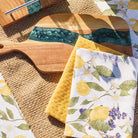 Rowan jute placemat styled with serving boards and lemon-print tea towels