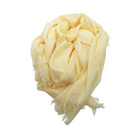 Beauty in Bamboo scarf in Lemon Meringue, a pale buttery yellow, loosely bundled