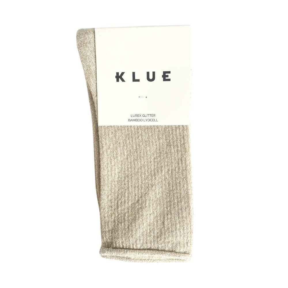 Beige KLUE glitter lurex socks folded in their branded paper band
