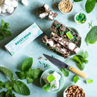 Pebbly Path Mint Motorway rocky road box with cut slices, fresh mint, green sprinkles and jelly pieces, seen from above