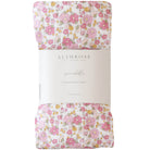 Rolled muslin swaddle in pink floral print with Alimrose paper band packaging