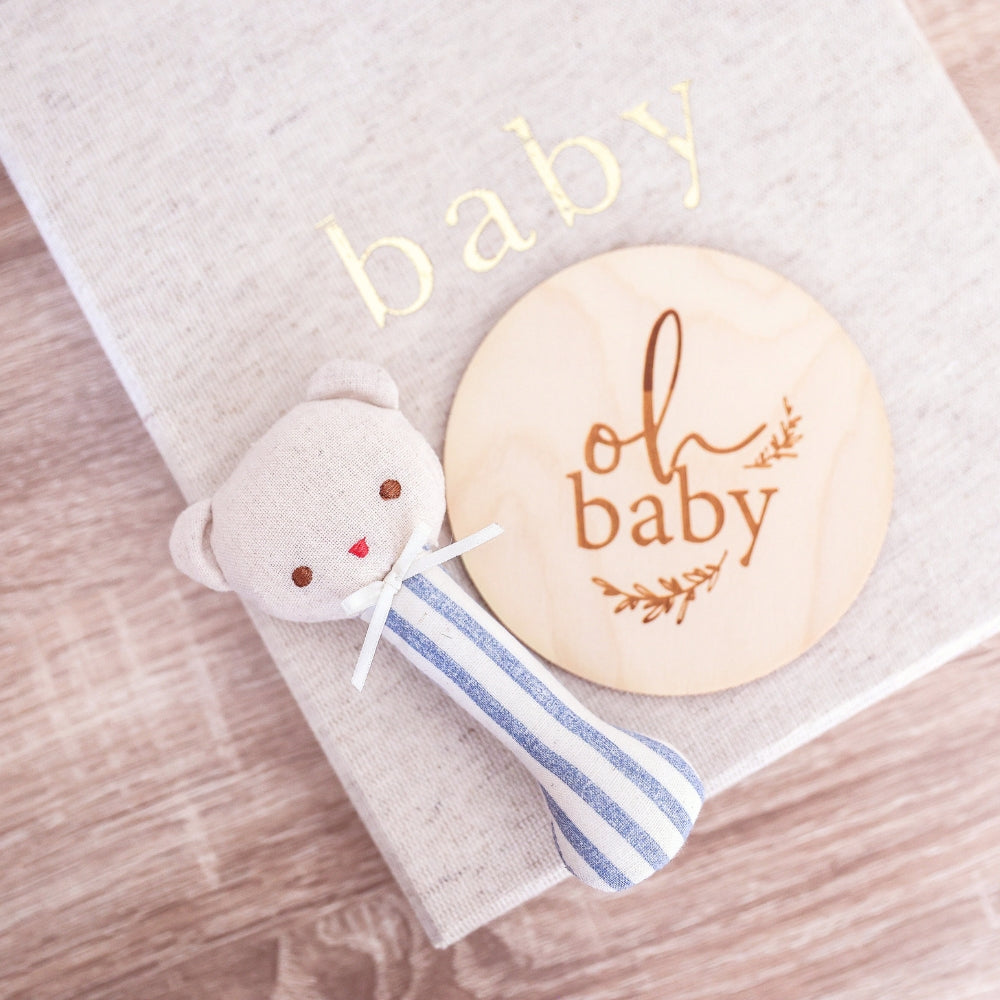 Ted bear stick rattle in chambray stripe styled with an oh baby milestone disc