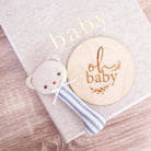 Ted bear stick rattle in chambray stripe styled with an oh baby milestone disc