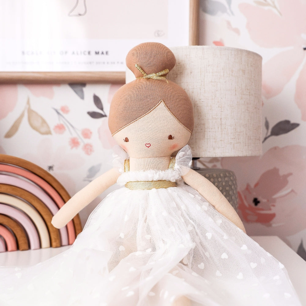 Close view of Lottie doll showing gold waistband and heart-flocked tulle skirt