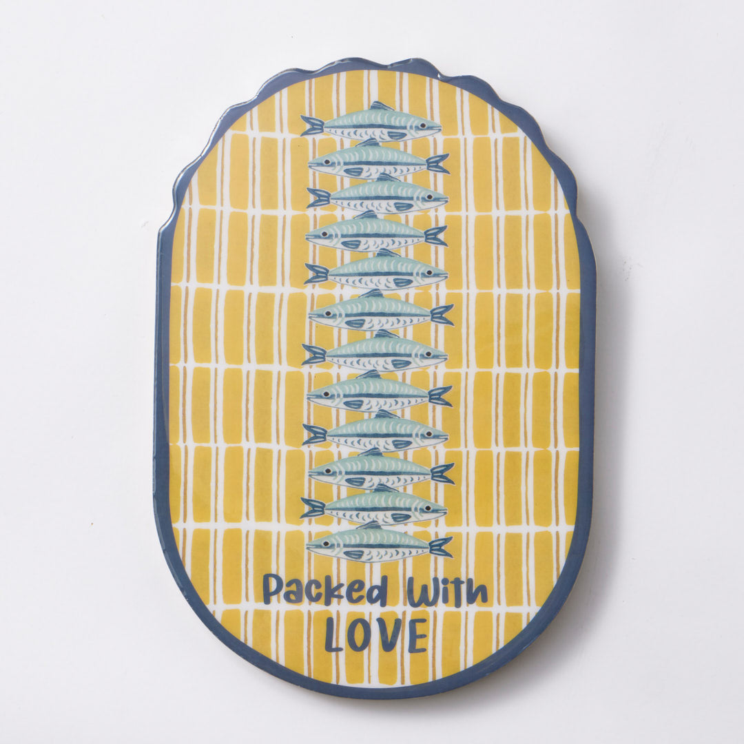 Oval mango wood wall plaque with a navy scalloped edge, a column of blue sardines down a yellow and white stripe, and packed with love in navy lettering at the base