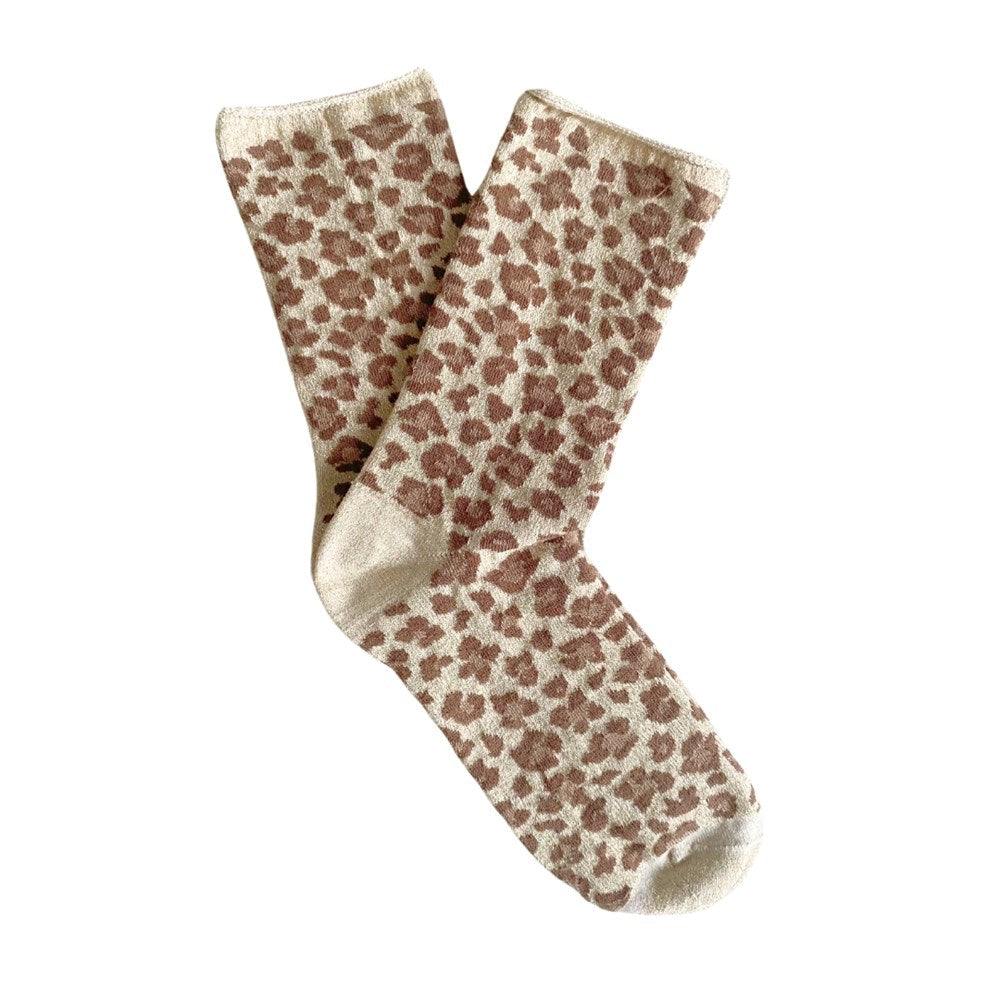 Pair of leopard print KLUE lurex socks laid flat on a white background