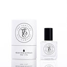 The Perfume Oil Company white gift cylinder beside a 10 ml bottle of perfume oil, studio lit on white