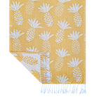 Corner detail of the reversible yellow pineapple weave with knotted fringe