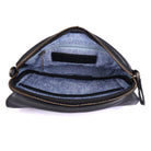 The black bag unzipped from above, showing the blue lining and inner pockets