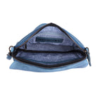 The denim blue bag open from above, showing the lining and inner pockets