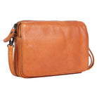 Tan leather cross body bag angled, the flap closed over the front