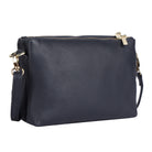Navy cross body bag angled to show the depth of its two zip compartments