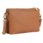 Tan pebbled leather cross body bag angled, the strap clipped at each side