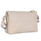 Vanilla cream cross body bag angled to show the depth of its two zip compartments