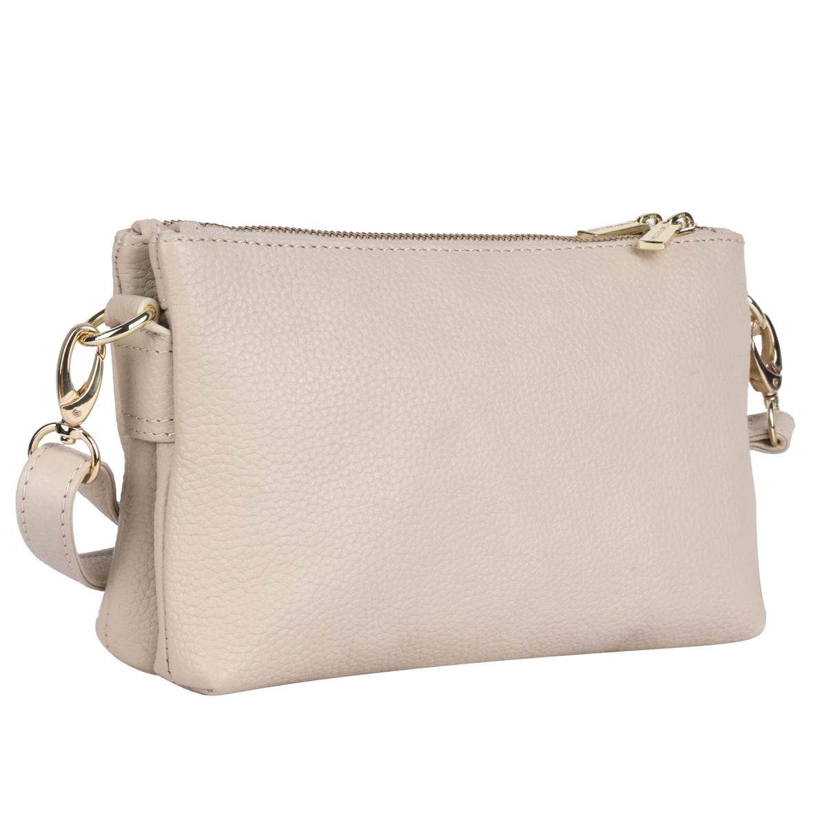 Vanilla cream cross body bag angled to show the depth of its two zip compartments
