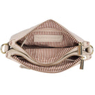 The vanilla bag unzipped from above, showing the striped fabric lining and inner pockets