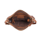 The oak bag unzipped from above, showing the brown fabric lining, inner pockets and a stamped leather tab