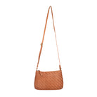 Tan woven bag hanging at full length from its long strap