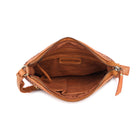 The tan bag unzipped from above, showing the lining and inner pockets