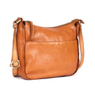 Tan leather bag angled, showing the rounded base and front pocket