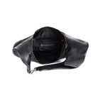 The black bag unzipped from above, showing the black lining, an inner zip pocket and a stamped leather tab