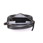 The black bag unzipped from above, showing the striped lining