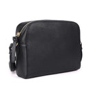 Black boxy cross body bag angled, showing its depth