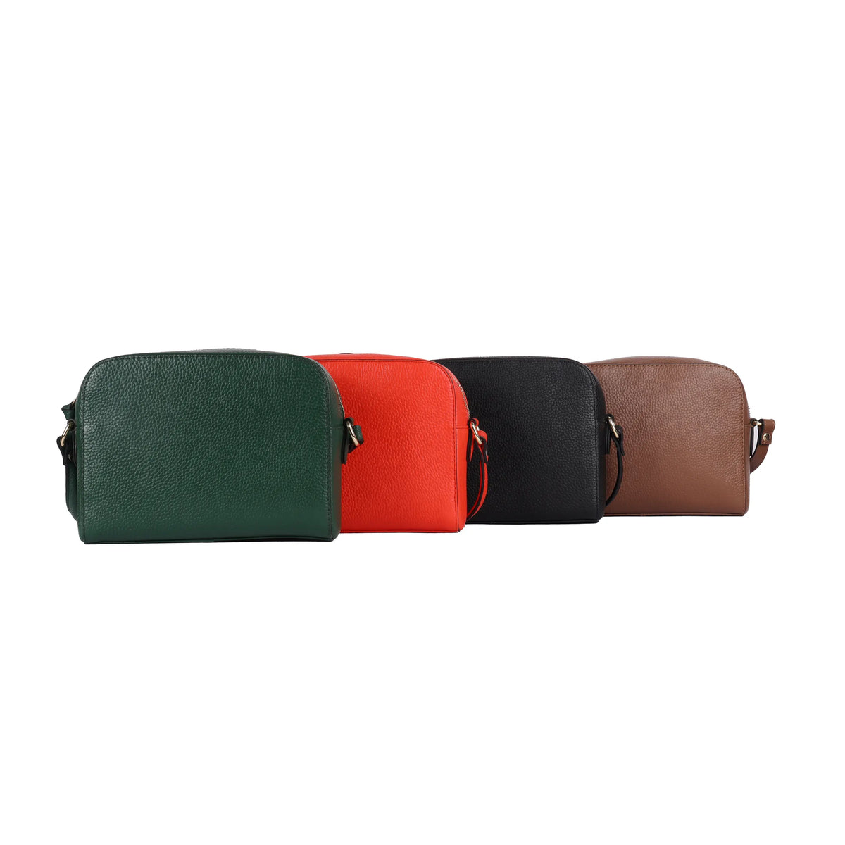 Boxy cross body bags lined up in green, mandarin, black and dark tan
