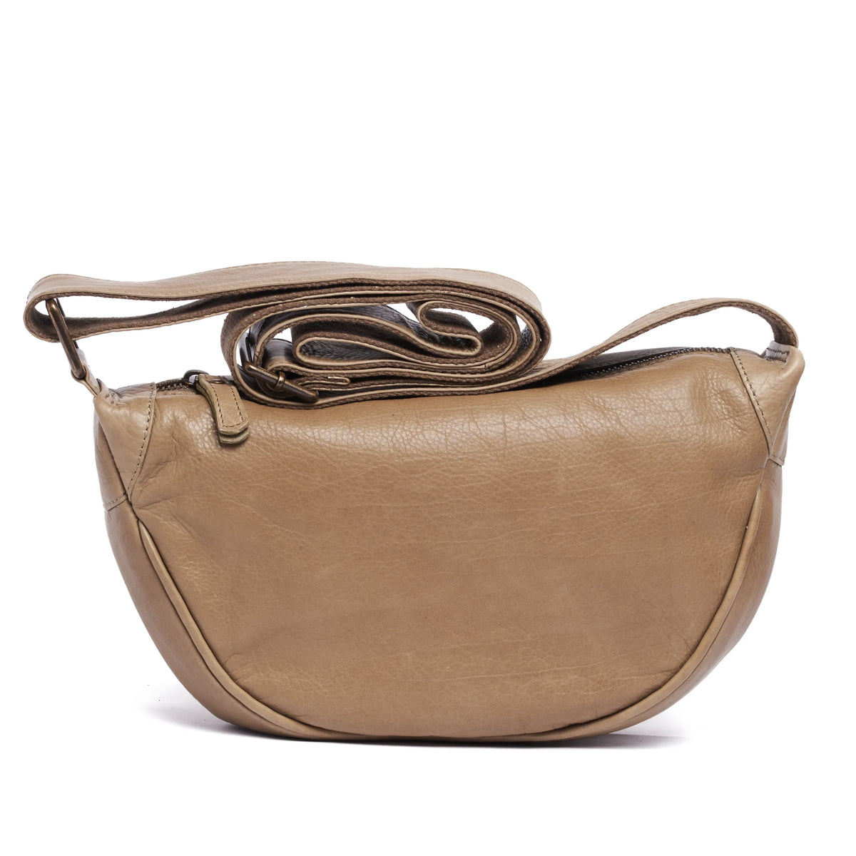 Latte leather half-moon cross body bag with its long strap looped above