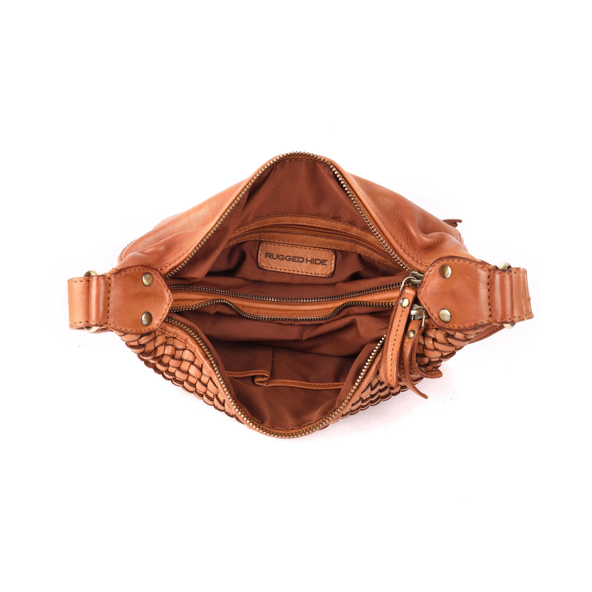 The tan bag open from above, showing the brown fabric lining, inner zips and a stamped leather tab