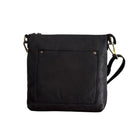Black leather cross body bag with a riveted front pocket and adjustable strap