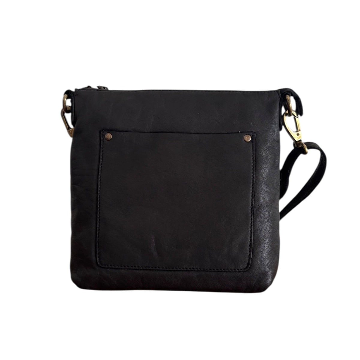 Black leather cross body bag with a riveted front pocket and adjustable strap