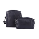 Navy sling bag beside a smaller navy zip bag from the same range