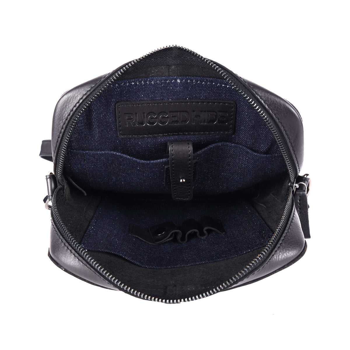 The black bag open, showing the dark navy lining and a stamped leather tab