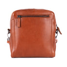Back of the cognac sling bag, showing the zip pocket