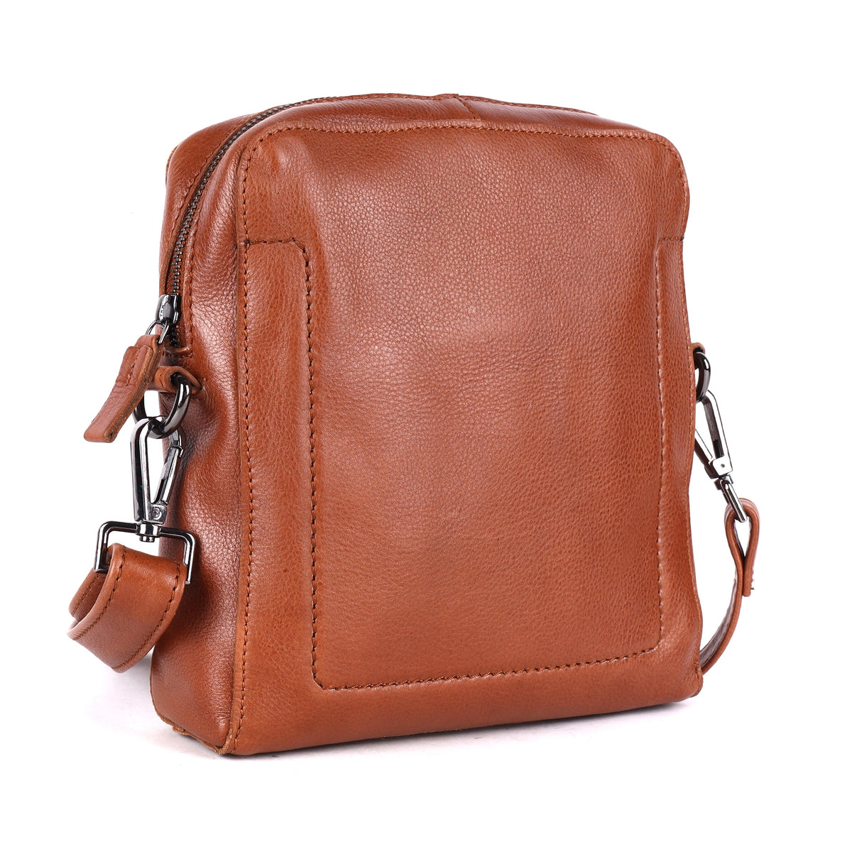 Cognac sling bag angled, showing the side seam and strap clip
