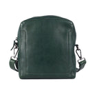 Green sling bag from the front, with the stitched panel on the front