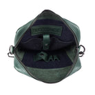 The green bag open, showing the dark navy lining and the tablet sleeve tab