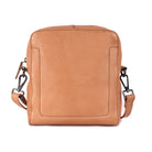 Nude sling bag from the front, with the stitched panel on the front